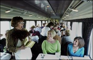 Dana Fields Sell entertains passengers on the Blissfield-based Old Road Dinner Train.
