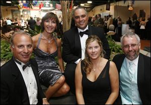 Craig Joseph, left, Marla Schecht, Gus Mancy, Terri Thompson, and Ty Szumigala at the Taste of the Nation Toledo event at the Erie Street Market.
