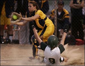 Clay s Kelsey Kelley is forced at home plate in the sixth inning by ND s Angie Bollin.
