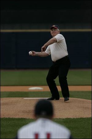 Fred Dailey, director of the Ohio Department of Agriculture, delivers a ceremonial pitch at Fifth Third Field.