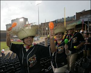 The Swamp Squad - from left, Katie DeLong, Jaime Golupski and Chad Rutkowski - was in the right place last night. Unfortunately, it was the wrong place for a baseball game as the Mud Hens and Buffalo Bisons were rained out.