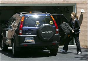 Brenda Roethlisberger, Ben s stepmother, loads the family vehicle en route to Pittsburgh to see Ben in the hospital.
