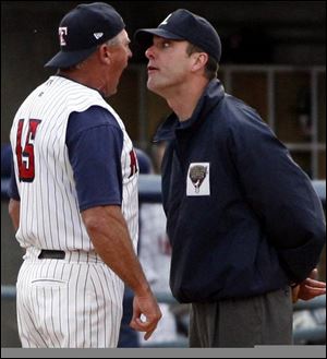 Hens' manager Larry Parrish did not win this argument with umpire Chris Hubler who sent Parrish to the showers early. By JOHN WAGNER