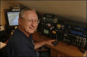 Amateur radio enthusiast Steve Michalski uses his equipment to relay calls for rescues at sea. 