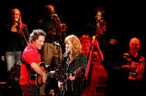Bruce Springsteen performs with his wife, Patti Scialfa, and the Seeger Sessions Band.