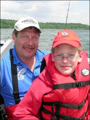 Fred Lederer and his 10-year-old son, Jacob, fish for muskies on the Clear Fork Reservoir.