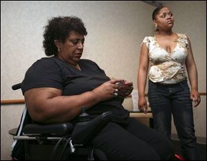 Eunice Amison, left, mother of the victim, appears at a press conference with Deonica Smith, Daisy's biological sister.