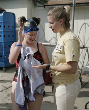 The area's Special Olympians who are involved in the USA National Games include swimmer Katie Rupert, 16, of Grand Rapids, Ohio, getting advice from her coach, Kali Shirley of Bowling Green.