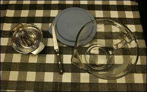 To prepare the merchandise, from left: a metal juicer, a sharp knife resting on the two-quart measure's lid, and the measure.