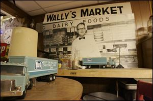 An enlarged photo of Wally Iott at his first grocery adorns a room inside the house.