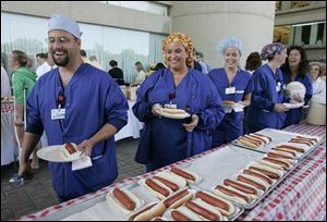Hospital operating room employees were treated to hot dogs during a celebration picnic at the Health Science Campus.