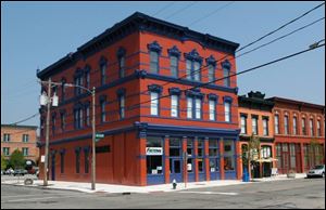 The colorful 19th-century buildings along St. Clair and Lafayette Streets house several businesses, including Dowtown Latte, AHAVA Spa, and Cold Fusion Creamery, and 11 loft-style apartments. The village, situated near Fifth Third Field, is viewed as the centerpiece of downtown revitalization. The Toledo Warehouse District Association owns the project.