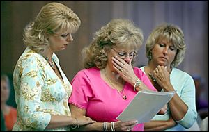 Claudia Frater, center, reads a statement to the court during the sentencing of Brian Gerwin. She is joined by her daughter Michelle Lindsay, left, and the victim's advocate Sue Jenkins.