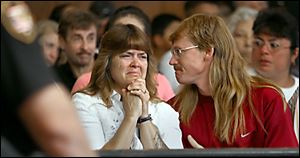 Toni Singleton reacts to the sentence given to Brian Gerwin, who overturned his car in a 2004 drunken-driving accident, killing three of his passengers, including her son Travis Druckenmiller. She is comforted by Rex McKnight.