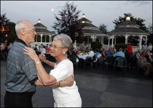 MOONLIT DANCE: As night falls upon Centennial Terrace, Leon Baumer and June Bailey's dance is sweetened by the nostalgic melodies of the Johnny Knorr Orchestra.