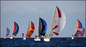 The first group of sailboats heads to the finish line during last Wednesday night's races, which are held every week at North Cape Yacht Club in LaSalle, Michigan.