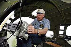 Reg liberty12p  blade photo by herral long  jujly 12 2006   Leonard Kettel of Huron checks out   machine gun on the b 17   Summary: The Liberty Belle WWII B-17 Bomber is on the ground for public tours..want shots of the plane with people looking at it...  (last week, we went up in aplane with a reporter - so want something different,but to let people know the plane is here to see and fly in later in the week)  Sandusky Monday-Wednesday (then to Port CLinton for public flights the rest of the week and weekend) ______