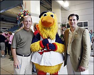 Judd Silverman, left, and Joe Napoli take time out to pose with Muddy.