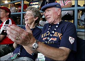 Evelyn and Dick Buchholz, of Lambertville, clap and cheer for the International League all-stars.