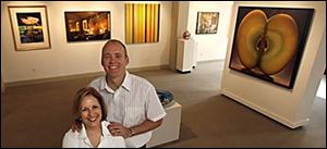 Scott and Barbara Hudson with some of the works in the exhibit in their relocated gallery.