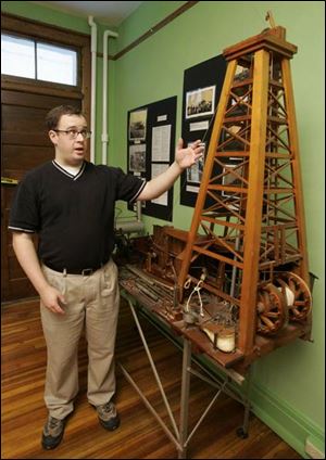 Randy Brown of the Wood County Historical Center and Museum discusses a model of a rig from the early 1900s.