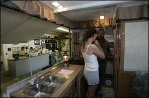 Sara Sendelbach and her fiance, Ron DeShetler, check out a camper at Coleman Sales & Service. 