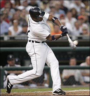 Craig Monroe connects for a grand slam in the sixth inning when the Tigers scored all of their runs in a victory over the White Sox last night at Comerica Park. Monroe's second career slam was the first hit by a Tiger this season.