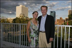 ROOF PROOF: On a perfect midsummer night, Sandra and Greg Chesnutt have a breathtaking view of the downtown from the Main Branch library.