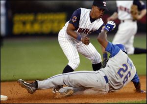 Hens shortstop Ramon Santiago applies the tag to Durham runner Delmon Young, but the Bull was ruled safe on the play last night at Fifth Third Field.