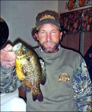 William Reed, of Kingsville, holds his record 1.19-pound warmouth sunfish taken on a flathead minnow in LaDue Reservoir in Geauga County. The panfish measured 10.5 inches and beat the previous largest warmouth sunfish which weighed an even one pound.