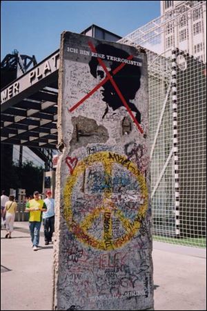 Pieces of the Berlin Wall remain in Berlin, painted with colorful graffiti and political statements. A block-long section stands across from the Berlin Wall Documentation Center.