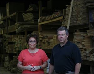 James Eloff plans to fund Kayo Lumber's pension plan sufficiently to cover office manager Judy Nolan, left, and one other employee. 
