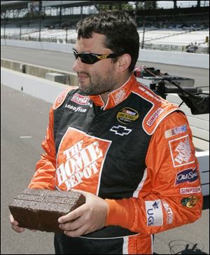 Tony Stewart holds one of the original bricks from the Indianapolis Motor Speedway that was presented to him yesterday. The Indiana native went to the Brickyard as a youngster and dreamed of competing there.
Brickyard is 
sacred ground