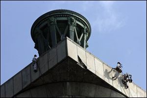 Workers inspected Perry's Victory and International Peace Monument last month. The landmark will reopen Saturday.