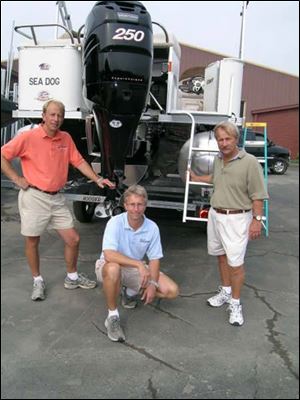 The Apling clan, from left, sons Pat and Mike and father, Dave, are off on another long tri-pontoon boat adventure.