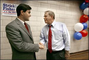 Toledo City Council candidate Joe McNamara, left, greets Democratic gubernatorial candidate Ted Strickland during a stop at the UAW hall yesterday. 