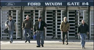 Employees leave Ford s Wixom Assembly Plant in Wixom, Mich., early this year. Ford s buyout plan will offer hourly workers varying amounts based on age and time of service.
