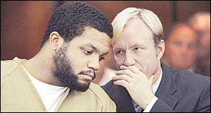 Ex-OSU football star Maurice Clarett listens to attorney Nick Mango before pleading guilty in court.
