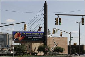 The new electronic billboards have been inspired by the Veterans' Glass City Skyway that's still under construction.