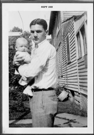 Jack Kennedy, Sr., cradles his son, Jack Kennedy, Jr. The younger Mr. Kennedy was just 4 years old when his father was killed.