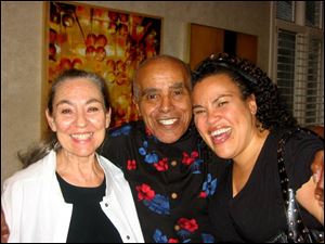 Toledo jazz great Jon Hendricks is flanked by his wife, Judith, left, and daughter, Aria, at his birthday party.
