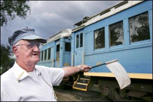 Volunteer Conductor Jim Tully directs the Bluebird Special into the station in Waterville.