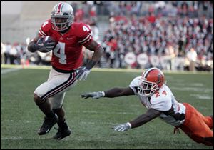 Ohio State receiver Ray Small slips past Bowling Green's Jahmal Brown and into the end zone.