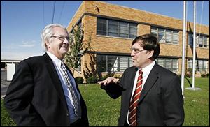 Gary Marck, left and Leo Deiger are subdividing the former AP Parts building.