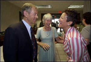 U.S. Sen. George Voinovich (R., Ohio) and his wife, Janet, amuse Bernadette Noe before the roast for her husband.