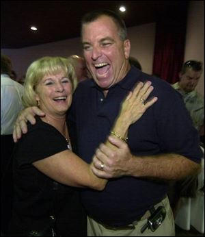 Former Toledo Mayor Donna Owens and Tom Noe ham it up before a roast for him in August, 2004. Ms. Owens was a conduit for Noe's illegal campaign contributions to President Bush.