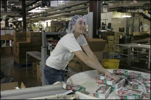 Melody Guilford arranges 40-cane boxes for packaging into cases.