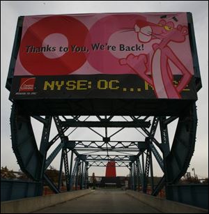 A banner at the entrance features the firm s Pink Panther mascot and new ticker symbol, OC.

