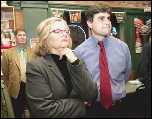 Joe McNamara, candidate for Toledo City Council, waits for election results at Wesley s Bar & Grill with supporters and his campaign co-chairmen, Keith Wilkowski, left, and Judy Stone.