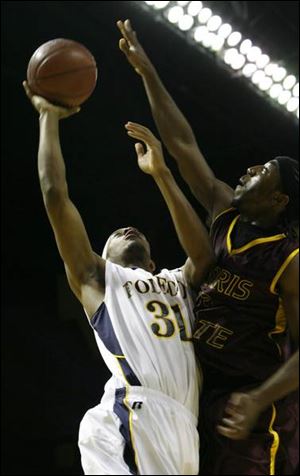 Toledo's Tyrone Kent drives to the basket against Ferris State last night in an exhibition game at Savage Hall.